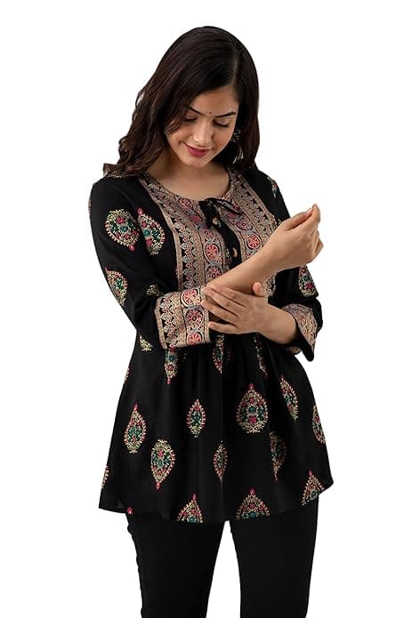 Woman wearing a brown party wear ethnic kurta style by Nishtha Chadda