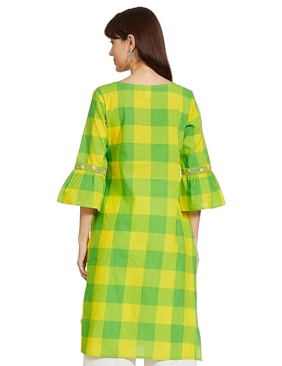 Woman wearing a mustard party wear ethnic kurta style by Nishtha Chadda