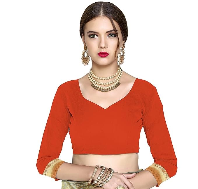 Woman wearing a red party wear ethnic kurta style by Nishtha Chadda