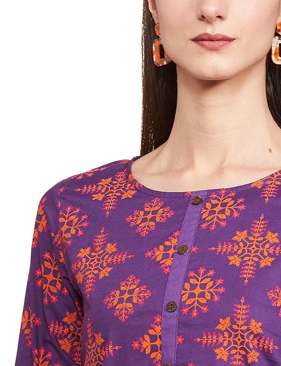 Woman wearing a red party wear ethnic kurta style by Nishtha Chadda