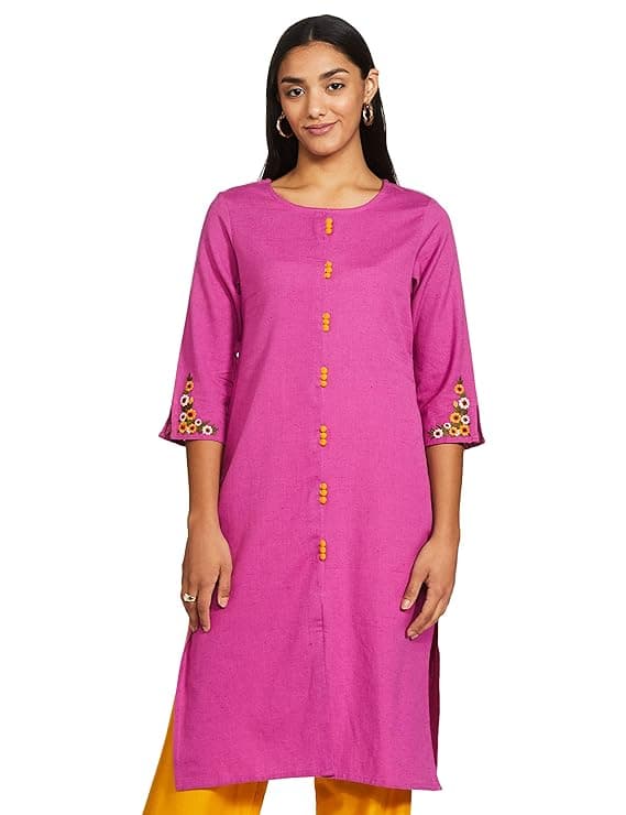 Woman wearing a pink party wear ethnic kurta style by Nishtha Chadda