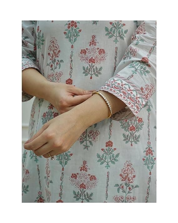 Woman wearing a grey party wear ethnic kurta style by Nishtha Chadda