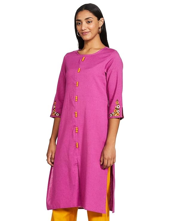 Woman wearing a coral party wear ethnic kurta style by Nishtha Chadda