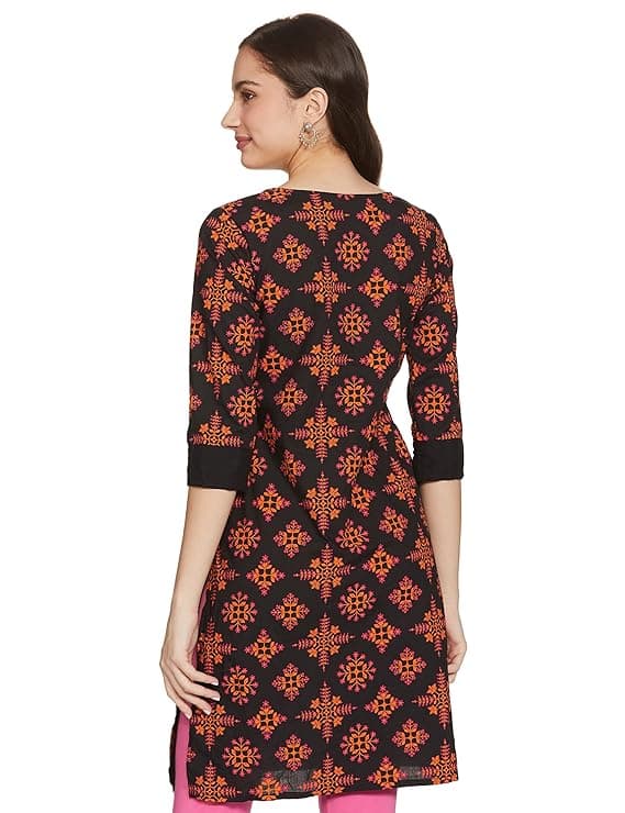 Woman wearing a brown party wear ethnic kurta style by Nishtha Chadda