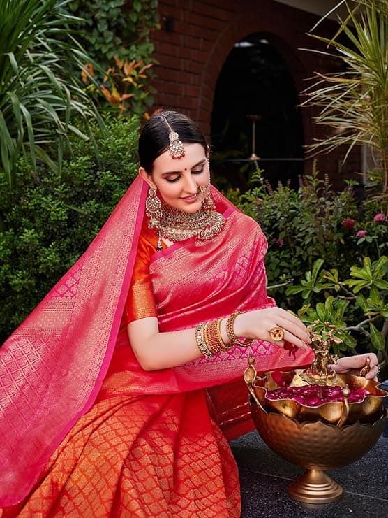 Woman wearing a red party wear ethnic kurta style by Nishtha Chadda