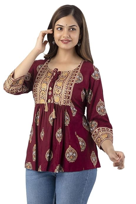 Woman wearing a maroon party wear ethnic kurta style by Nishtha Chadda