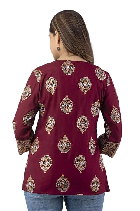 Woman wearing a maroon party wear ethnic kurta style by Nishtha Chadda
