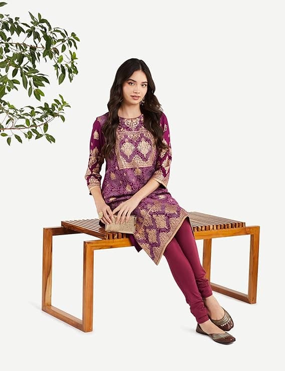 Woman wearing a brown party wear ethnic kurta style by Nishtha Chadda