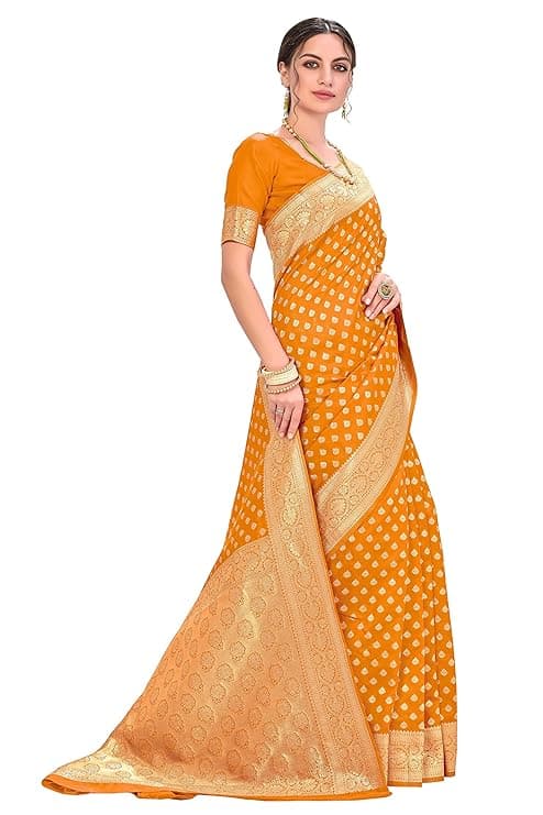Woman wearing a orange party wear ethnic kurta style by Nishtha Chadda