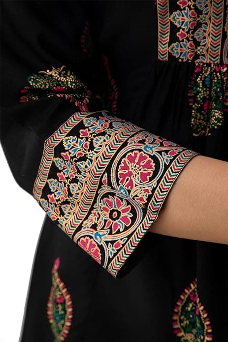 Woman wearing a brown party wear ethnic kurta style by Nishtha Chadda