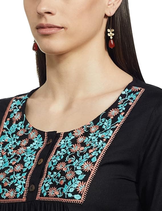 Woman wearing a grey party wear ethnic kurta style by Nishtha Chadda