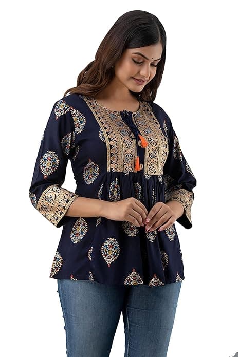 Woman wearing a brown party wear ethnic kurta style by Nishtha Chadda