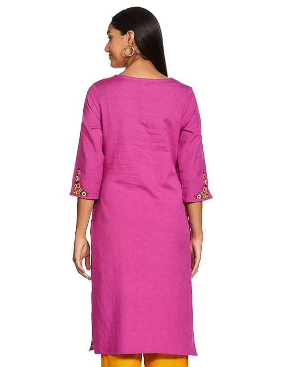 Woman wearing a pink party wear ethnic kurta style by Nishtha Chadda