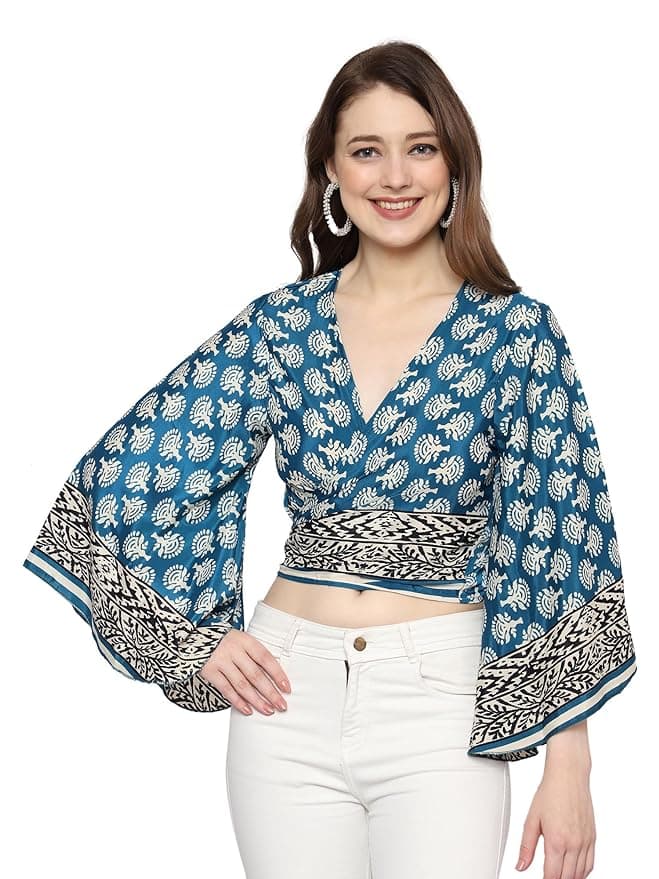 Woman wearing a teal party wear ethnic kurta style by Nishtha Chadda