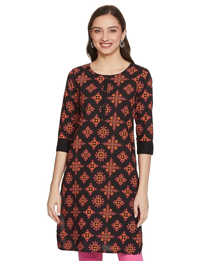Woman wearing a brown party wear ethnic kurta style by Nishtha Chadda