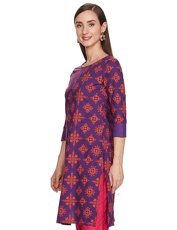 Woman wearing a brown party wear ethnic kurta style by Nishtha Chadda