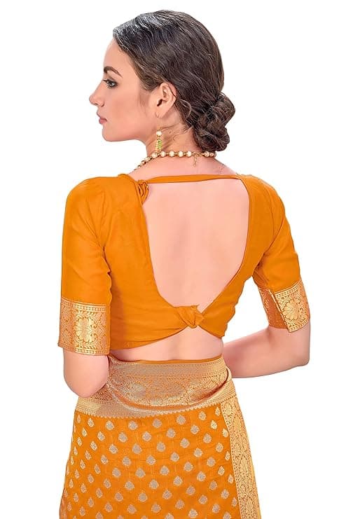 Woman wearing a orange party wear ethnic kurta style by Nishtha Chadda