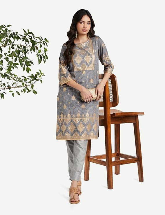 Woman wearing a brown party wear ethnic kurta style by Nishtha Chadda