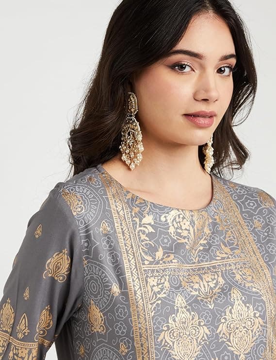 Woman wearing a brown party wear ethnic kurta style by Nishtha Chadda
