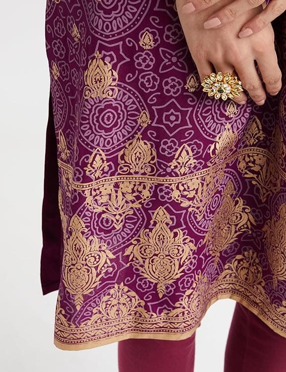 Woman wearing a maroon party wear ethnic kurta style by Nishtha Chadda