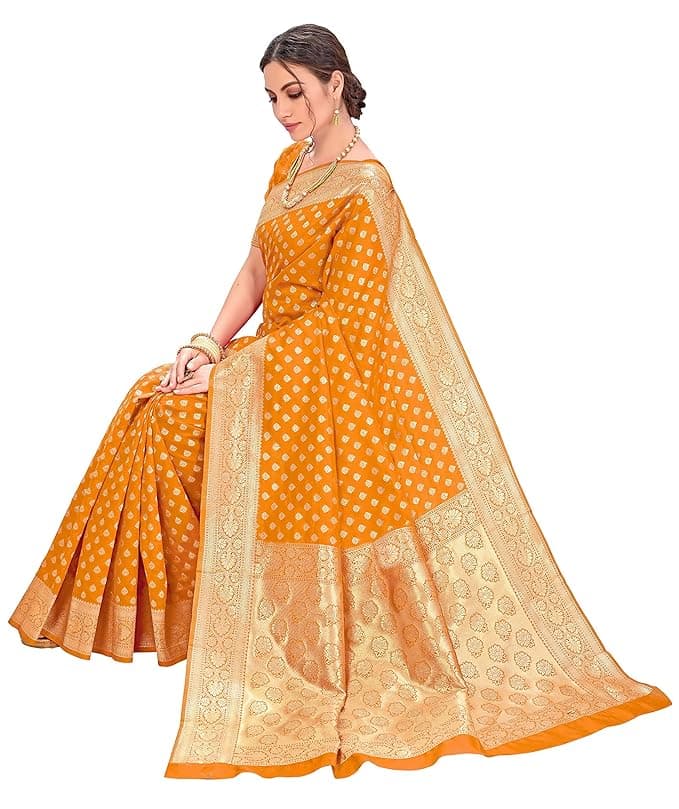 Woman wearing a orange party wear ethnic kurta style by Nishtha Chadda