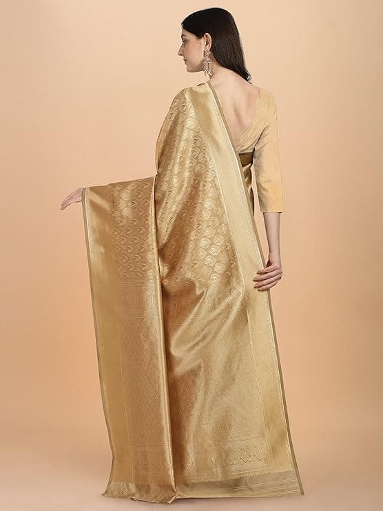Woman wearing a brown party wear ethnic kurta style by Nishtha Chadda
