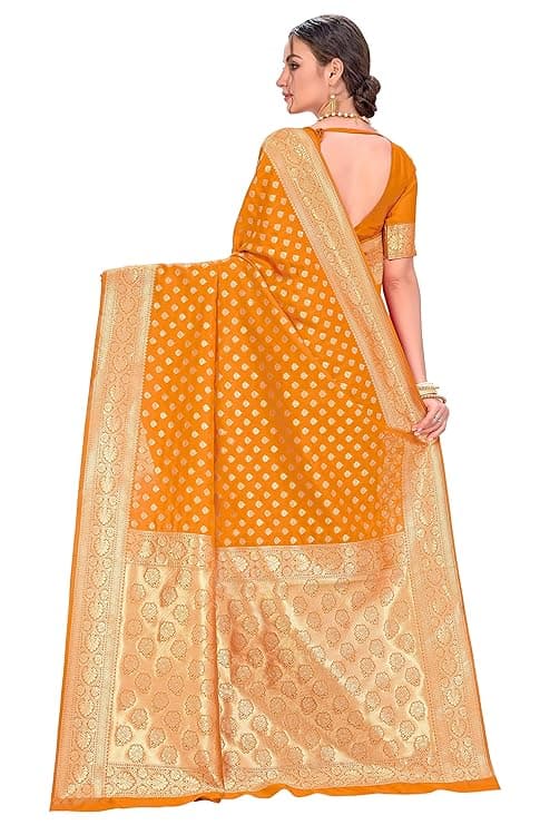 Woman wearing a orange party wear ethnic kurta style by Nishtha Chadda