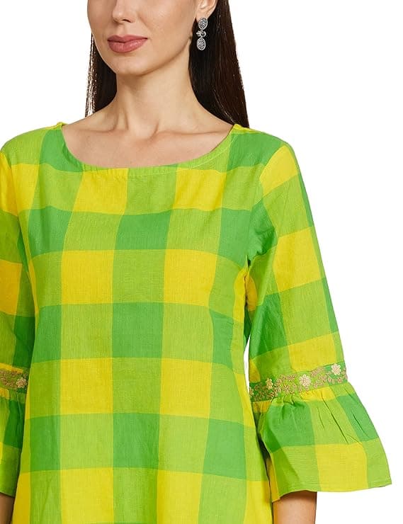 Woman wearing a mustard party wear ethnic kurta style by Nishtha Chadda