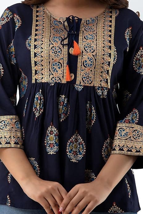 Woman wearing a brown party wear ethnic kurta style by Nishtha Chadda