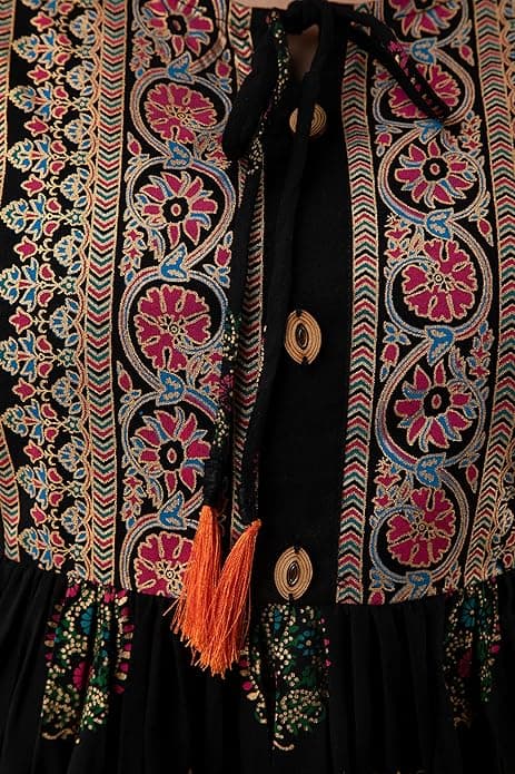 Woman wearing a maroon party wear ethnic kurta style by Nishtha Chadda