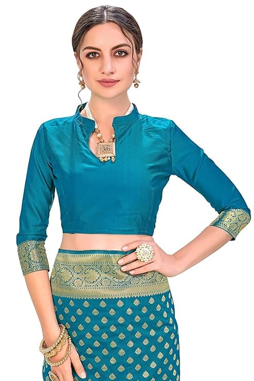 Woman wearing a teal party wear ethnic kurta style by Nishtha Chadda