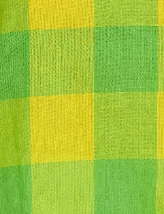 Woman wearing a yellow party wear ethnic kurta style by Nishtha Chadda