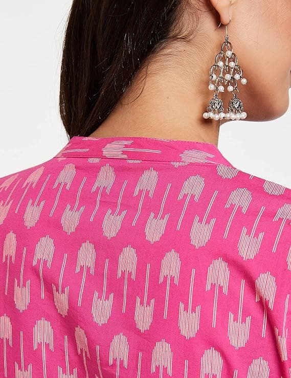 Woman wearing a pink party wear ethnic kurta style by Nishtha Chadda