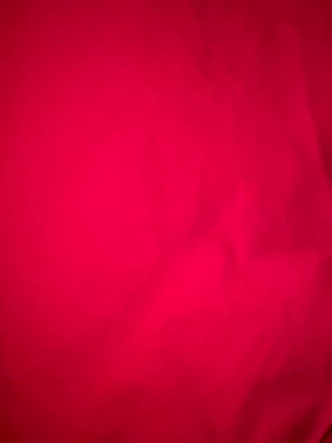 Woman wearing a red embroidered kurti set by Nishtha Chadda
