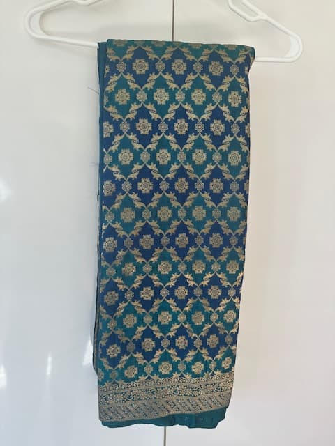 Woman wearing a navy embroidered kurti set by Nishtha Chadda