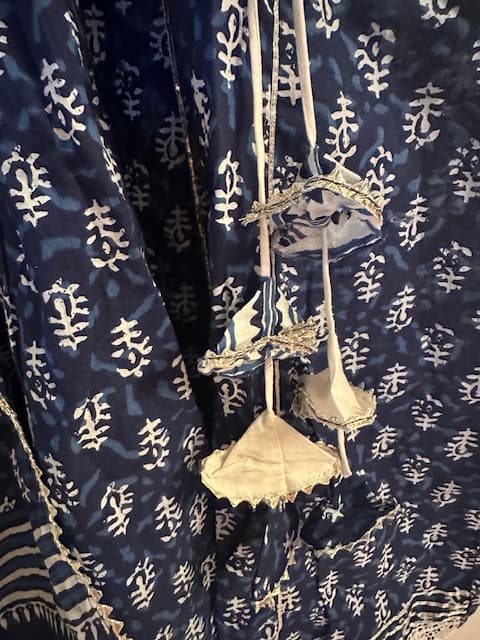 Woman wearing a navy embroidered kurti set by Nishtha Chadda