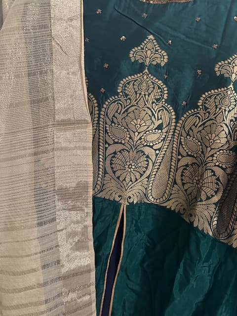 Woman wearing a black embroidered kurti set by Nishtha Chadda