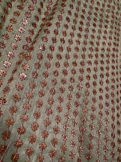Woman wearing a brown embroidered kurti set by Nishtha Chadda