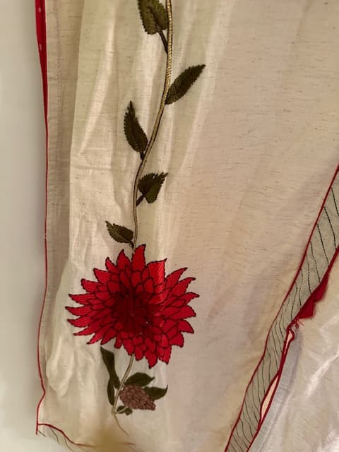 Woman wearing a maroon embroidered kurti set by Nishtha Chadda