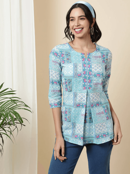 Woman wearing a olive indian kurti for women by Nishtha Chadda