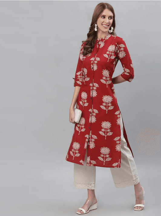 Woman wearing a red indian kurti for women by Nishtha Chadda