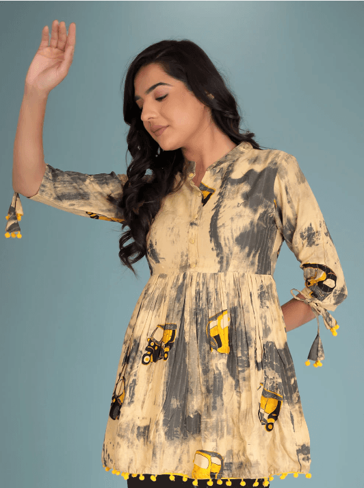 Woman wearing a coral indian kurti for women by Nishtha Chadda