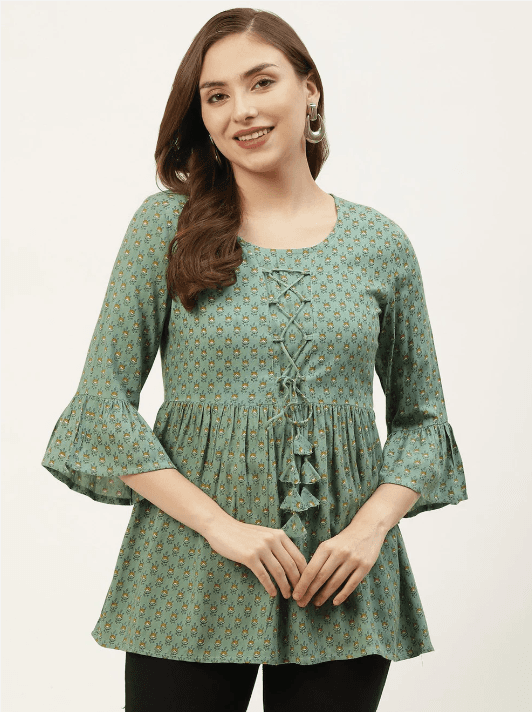 Woman wearing a olive indian kurti for women by Nishtha Chadda