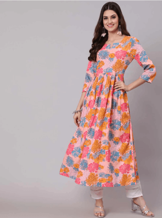 Woman wearing a coral indian kurti for women by Nishtha Chadda