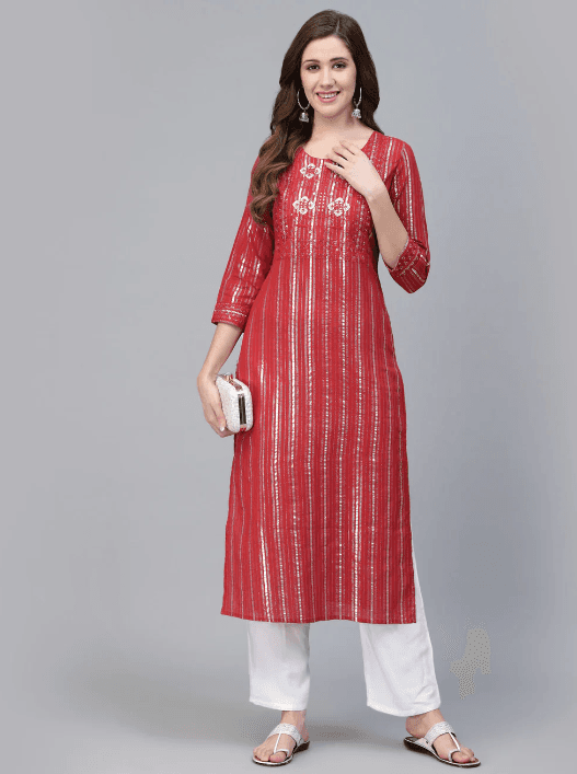 Woman wearing a red indian kurti for women by Nishtha Chadda