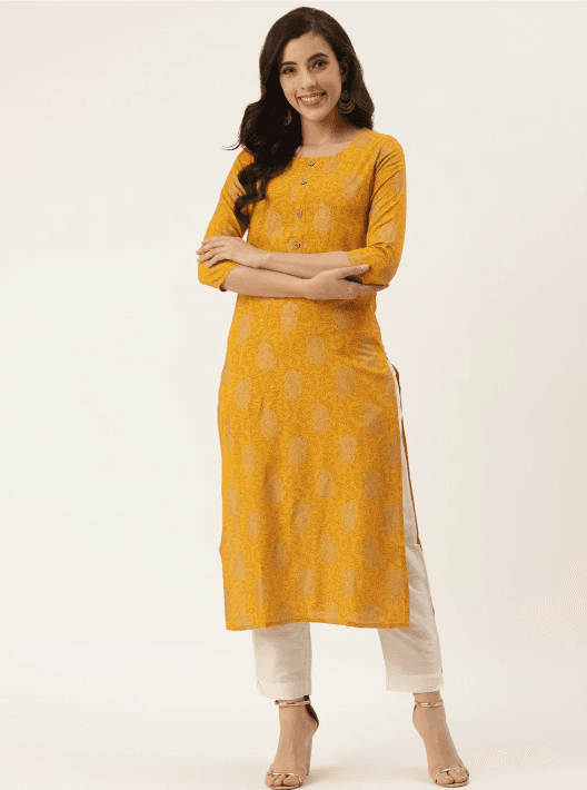 Woman wearing a mustard indian kurti for women by Nishtha Chadda