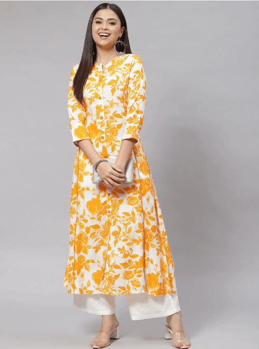 Woman wearing a mustard indian kurti for women by Nishtha Chadda