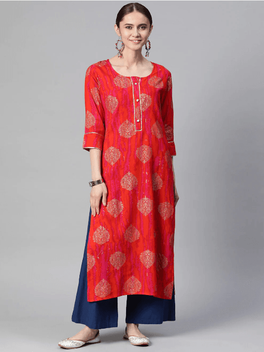 Woman wearing a red indian kurti for women by Nishtha Chadda