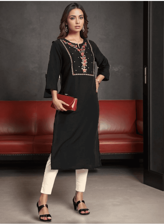 Woman wearing a maroon indian kurti for women by Nishtha Chadda