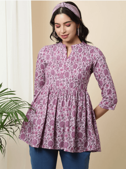 Woman wearing a brown indian kurti for women by Nishtha Chadda